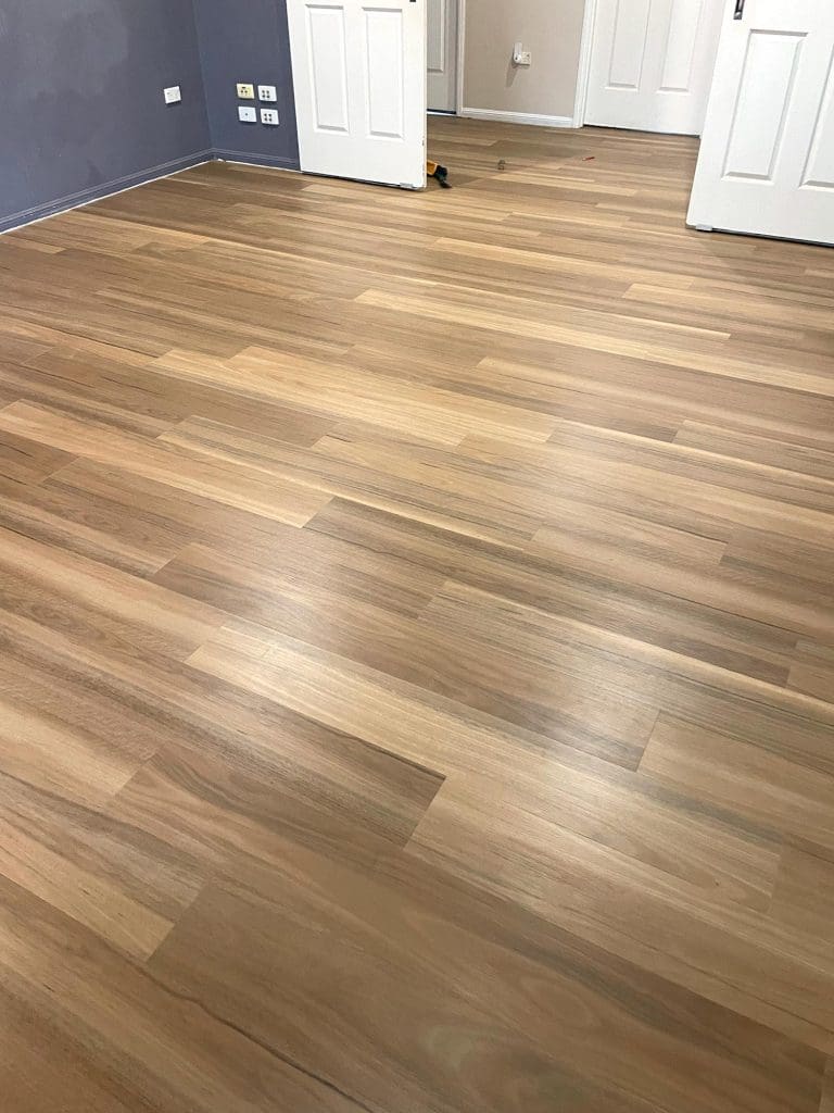 New flooring installed after carpet removal showing finished clean floor surface in Townsville